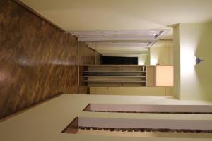 an empty room with a kitchen and a counter top at Apartment Novyj Svit in Lviv