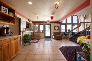 a room with a kitchen and a living room at Super 8 by Wyndham Las Vegas in Las Vegas