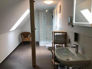 a bathroom with a sink and a toilet at Schöna Urlaub in Schöna +25 photos