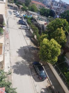 an overhead view of a street with parked cars at Malsi 2 Bedrooms Apartment in Vlorë