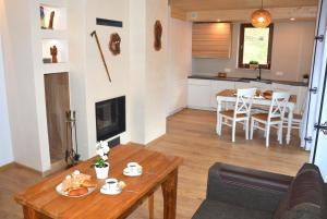 a living room with a table and a dining room at Przystań B2 in Jaworki