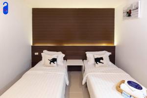 Katil atau katil-katil dalam bilik di Bed By City Hotel