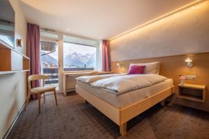 Postel nebo postele na pokoji v ubytování Hotel Gädi
