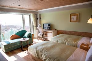 Cama ou camas em um quarto em Shiretoko Daiichi Hotel