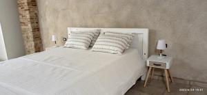 Кровать или кровати в номере Castello Room & Spa