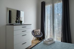 TV a/nebo společenská místnost v ubytování Katamera Guest House
