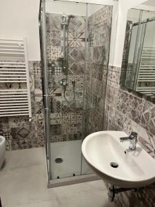 a bathroom with a sink and a shower at La pineta in Marina di Massa