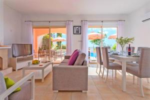 A seating area at Resitour - Perneri Three Bedroom Villas