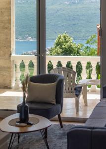 a living room with a view of the ocean at Zeleni in Đenovići