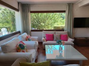 a living room with two couches and a table at Puente Canto de Gredos in Arenas de San Pedro