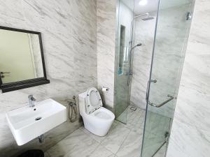 a bathroom with a sink and a toilet and a shower at Imperio Melaka Standard Suites by Jeffery Lam Home Management in Melaka +16 photos