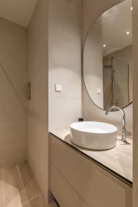 a bathroom with a sink and a mirror at MAR Luxury Apartment in Supetar