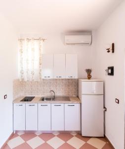 Virtuve vai virtuves zona naktsmītnē Vila Toskaj