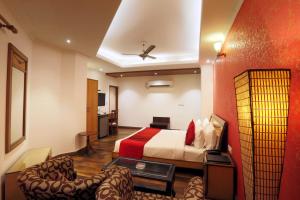 Postel nebo postele na pokoji v ubytování Airport Hotel Le Seasons New Delhi + 19 fotografií