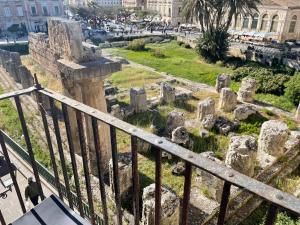 a view of the ruins of the ancient city at KLEOMENE tempio di Apollo in Siracusa