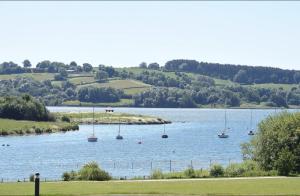 a large body of water with boats in it at Chatterbox Cottage in Wirksworth +4 photos
