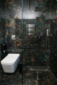 Koupelna v ubytování Chimaera Hotel