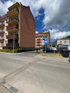 a building on the side of a city street at Apartament Dwupoziomowy - klimatyzacja in Słupsk