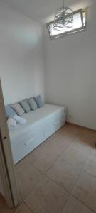 A bed or beds in a room at Stella Marina Holiday Home