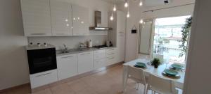 A kitchen or kitchenette at Stella Marina Holiday Home Még 31 kép
