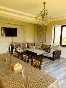 a living room with a couch and a table at Siran Guest House in Areni