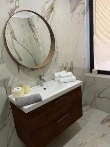 a bathroom with a sink and a mirror at Residenza Marcelli in Isernia