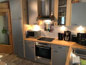 a kitchen with a sink and a stove top oven at Ferienwohnung Tirol in Landeck
