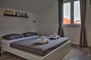 Postel nebo postele na pokoji v ubytování Apartments and Rooms B&B