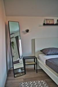 Postel nebo postele na pokoji v ubytování Apartments and Rooms B&B