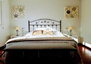 Ένα ή περισσότερα κρεβάτια σε δωμάτιο στο Vivienda Vacacional El Cuetu del Sella