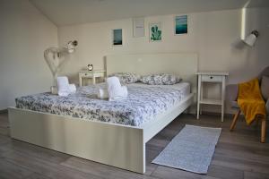 Postel nebo postele na pokoji v ubytování Apartments and Rooms B&B