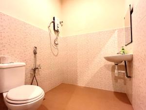 a bathroom with a toilet and a sink at VGO House in Malacca +15 photos