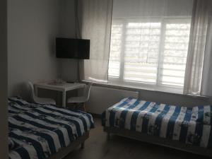 Postel nebo postele na pokoji v ubytování VillaDudek
