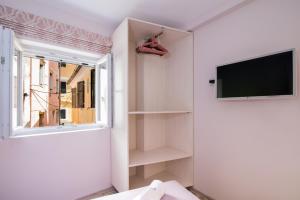 Televízia a/alebo spoločenská miestnosť v ubytovaní Electra's house