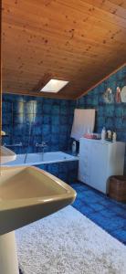 a bathroom with a tub and a sink at Villa for a get away in Soprabolzano +96 photos