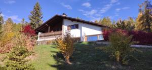 a house in the middle of a yard with trees at Villa for a get away in Soprabolzano