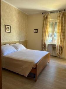 Postel nebo postele na pokoji v ubytování Albergo AQUILA