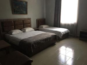 Letto o letti in una camera di Baron Hotel