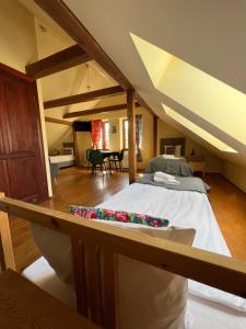 a bedroom with a large bed in a room at Gościniec FOLKier in Zgierz