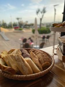 a basket of bread sitting on a table at Hotel De L'Océan in Biarritz