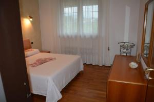 Ένα ή περισσότερα κρεβάτια σε δωμάτιο στο Casa Val del Mis - con vista su grande giardino