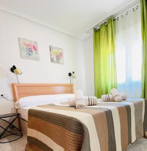Posteľ alebo postele v izbe v ubytovaní Apartamento Calipso Plus