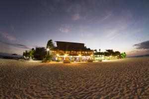 a hotel on the beach at night at Beachcomber Island Resort in Beachcomber Island