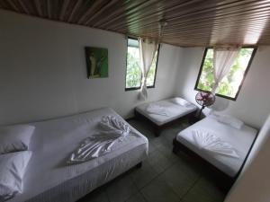 Postel nebo postele na pokoji v ubytování Casa Caribe