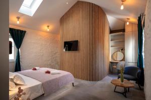 a bedroom with a bed and a large wooden wall at Good vibrations in center 80m2 for 2 GLAVICA in Hvar
