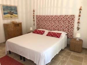 Postel nebo postele na pokoji v ubytování FICOMORO surf house