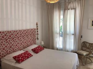 Postel nebo postele na pokoji v ubytování FICOMORO surf house