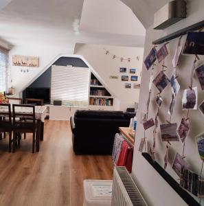 a living room with a couch and a table at Leylands - Perfect location near town and beach in Cromer
