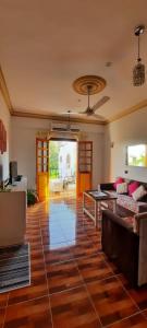 a living room with a couch and a table at House of Dreams apartments Luxor in Luxor