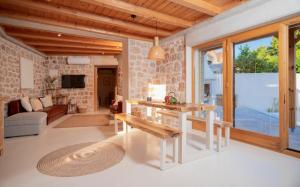 a living room with a table and a couch at Dolce Terra in Stari Grad